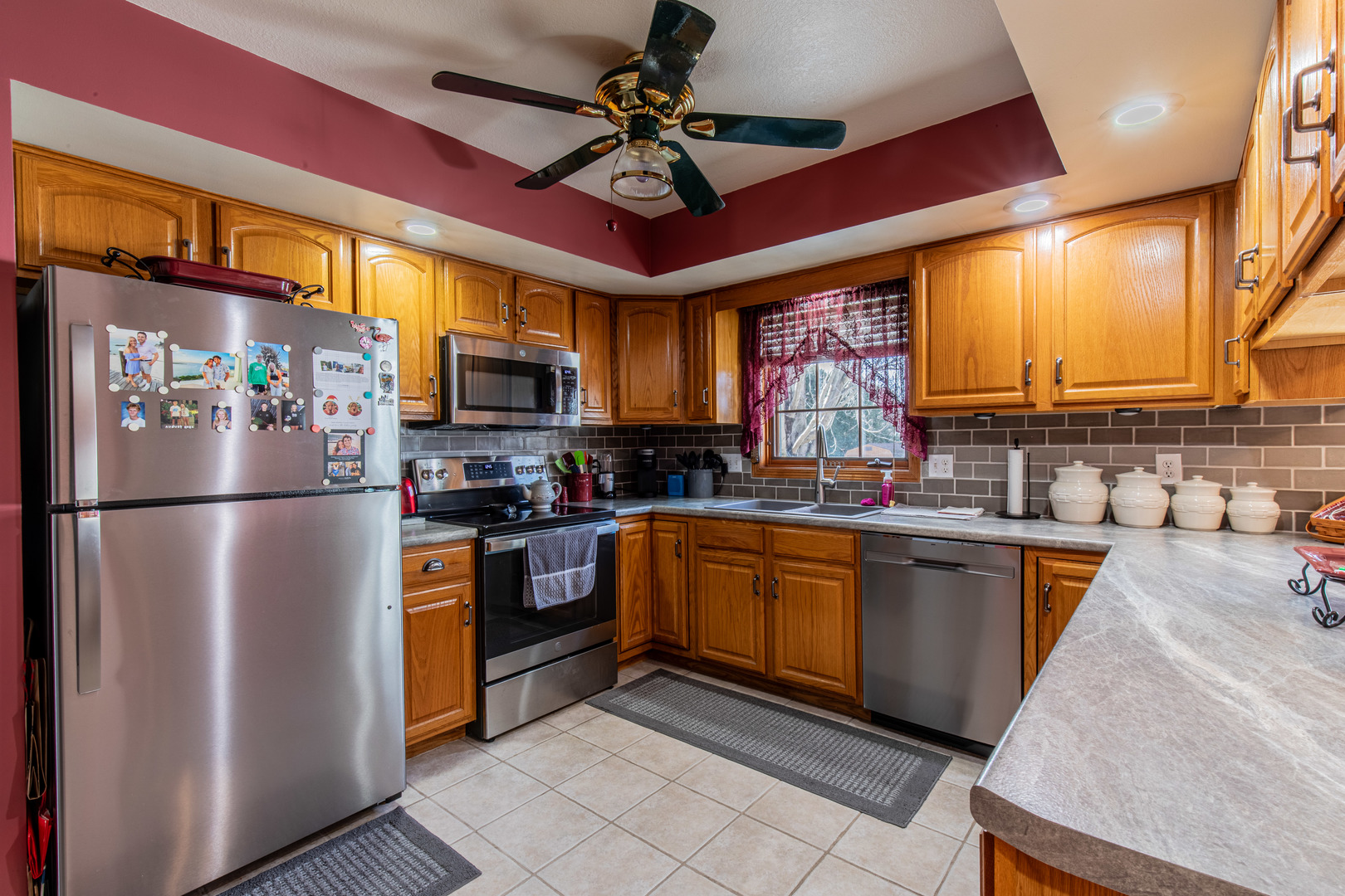 732 North Linn Street Princeton, IL 61356 - Photo 9 of 35 a kitchen with stainless steel appliances granite countertop a refrigerator a sink dishwasher a stove a washer and dryer with a dining table
