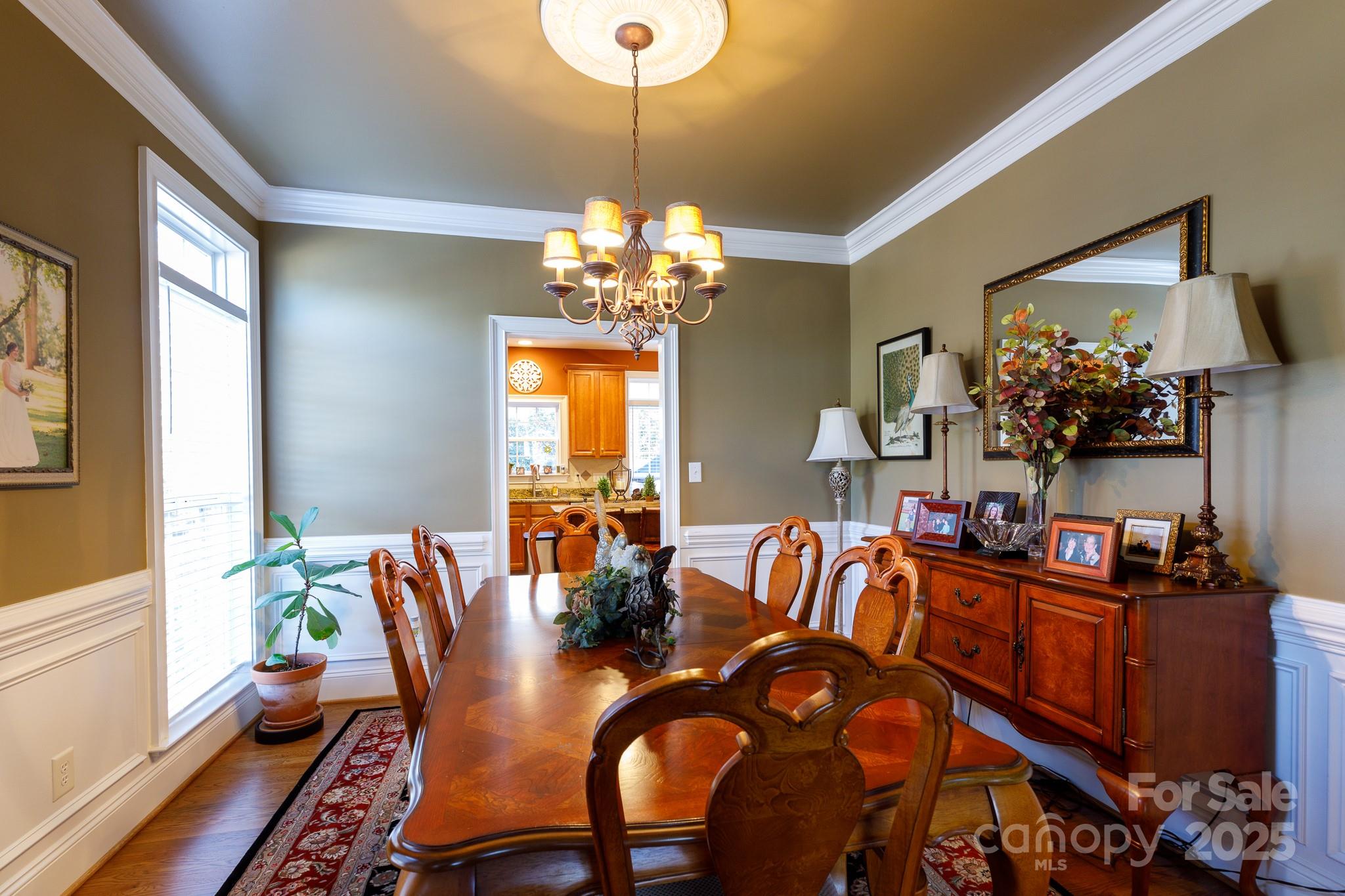 307 Abingdon Way Fort Mill, SC 29715 - Photo 11 of 26 a view of a dining room with furniture and chandelier