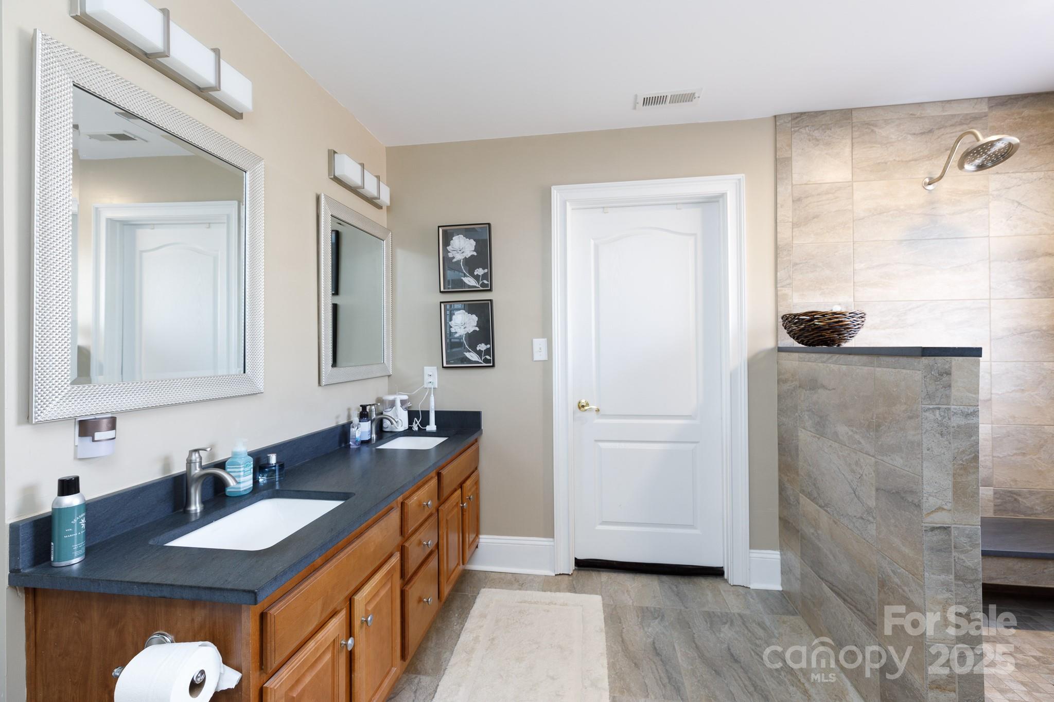 307 Abingdon Way Fort Mill, SC 29715 - Photo 16 of 26 a bathroom with a sink and a mirror