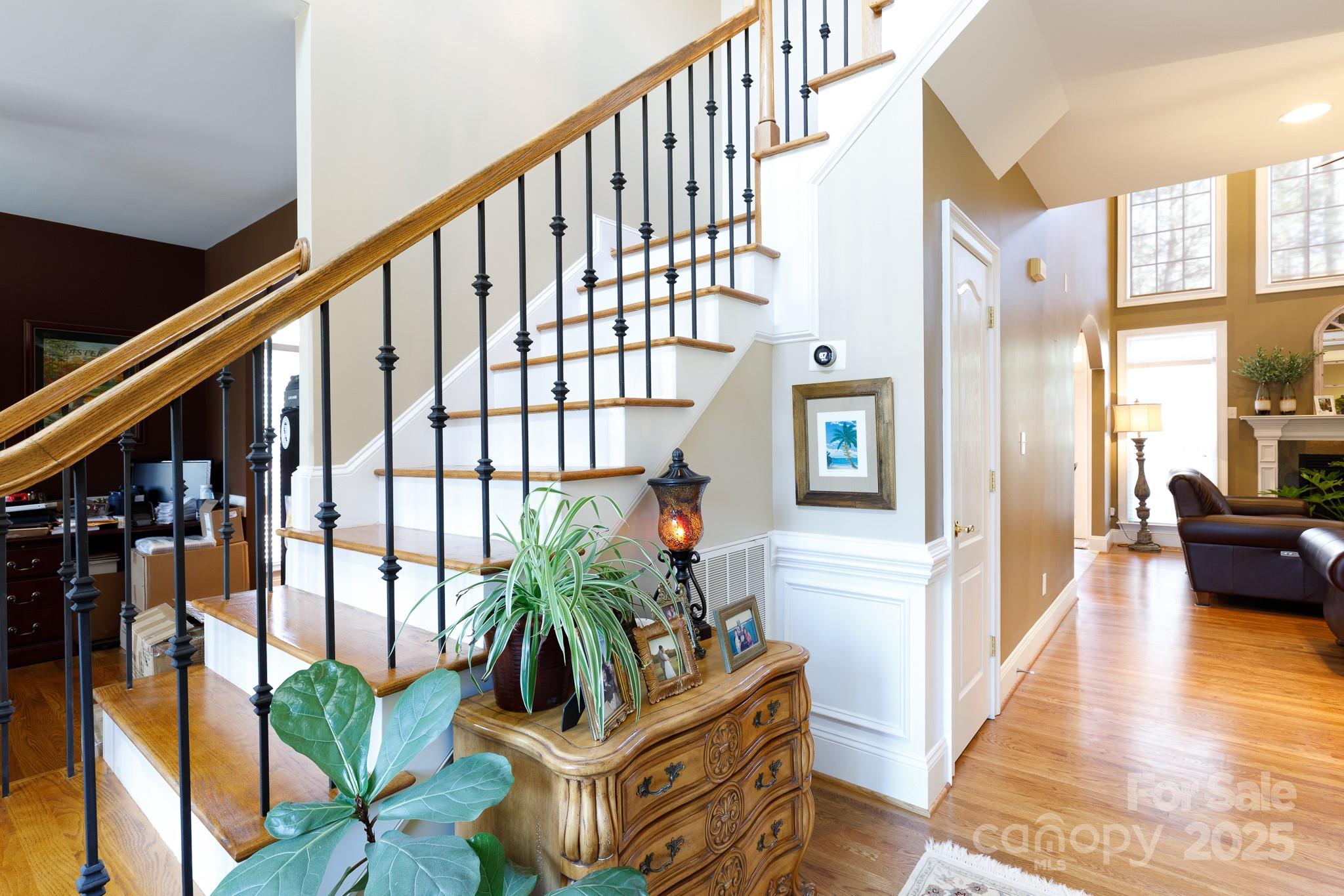 307 Abingdon Way Fort Mill, SC 29715 - Photo 2 of 26 a view of an entryway with wooden floor and a potted plant