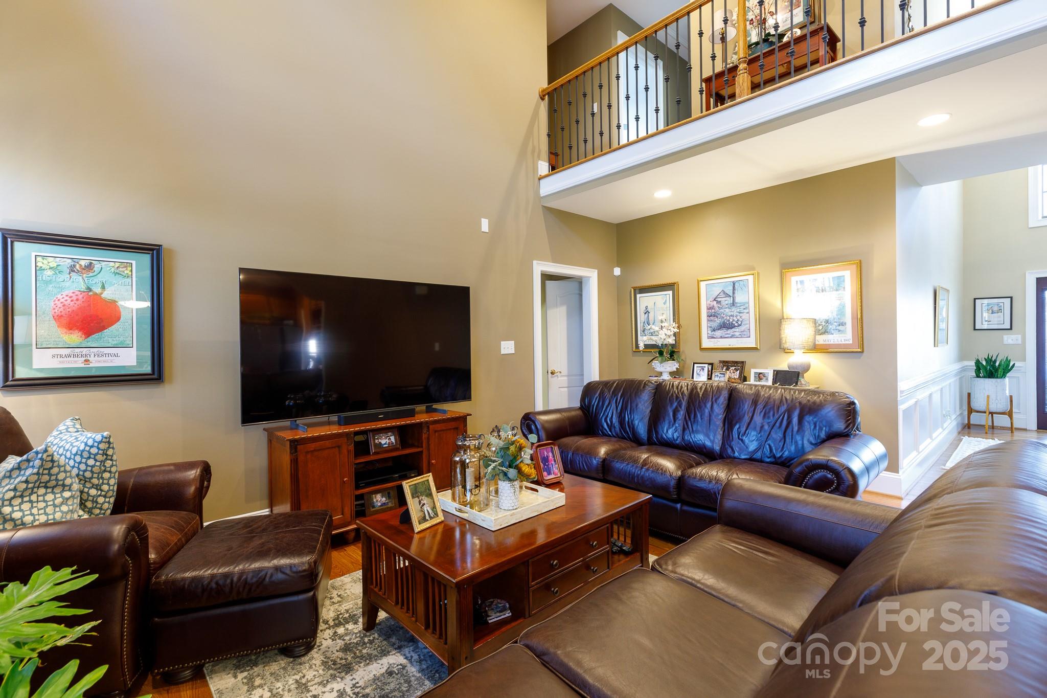 307 Abingdon Way Fort Mill, SC 29715 - Photo 4 of 26 a living room with furniture and a flat screen tv