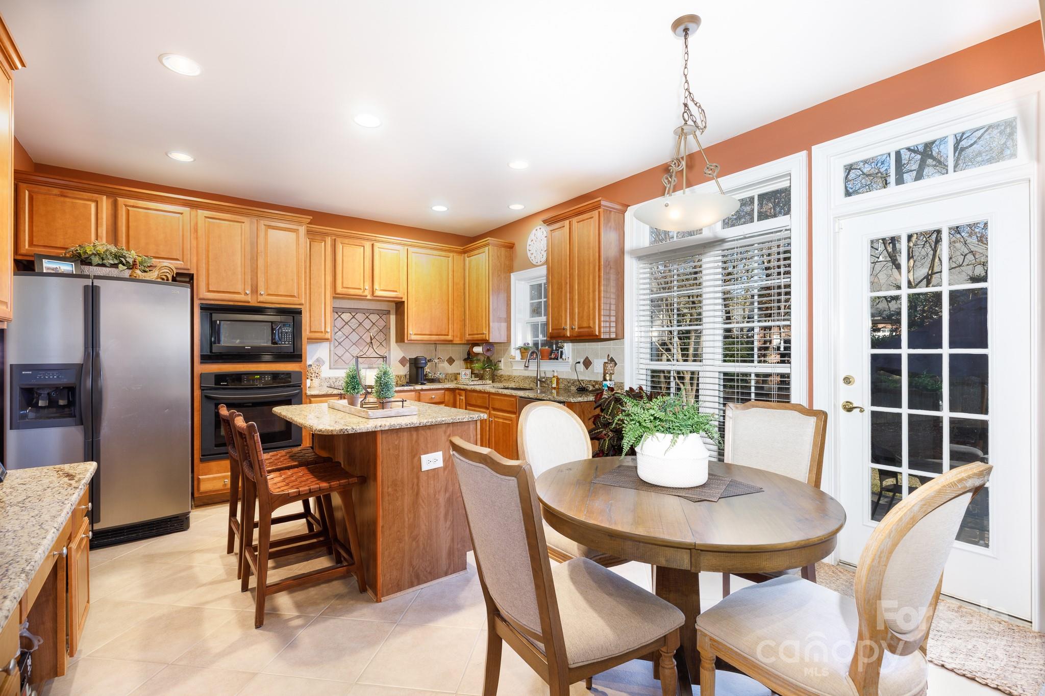 307 Abingdon Way Fort Mill, SC 29715 - Photo 7 of 26 a view of a dining room with furniture window and outside view