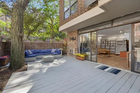 a swimming pool with outdoor seating