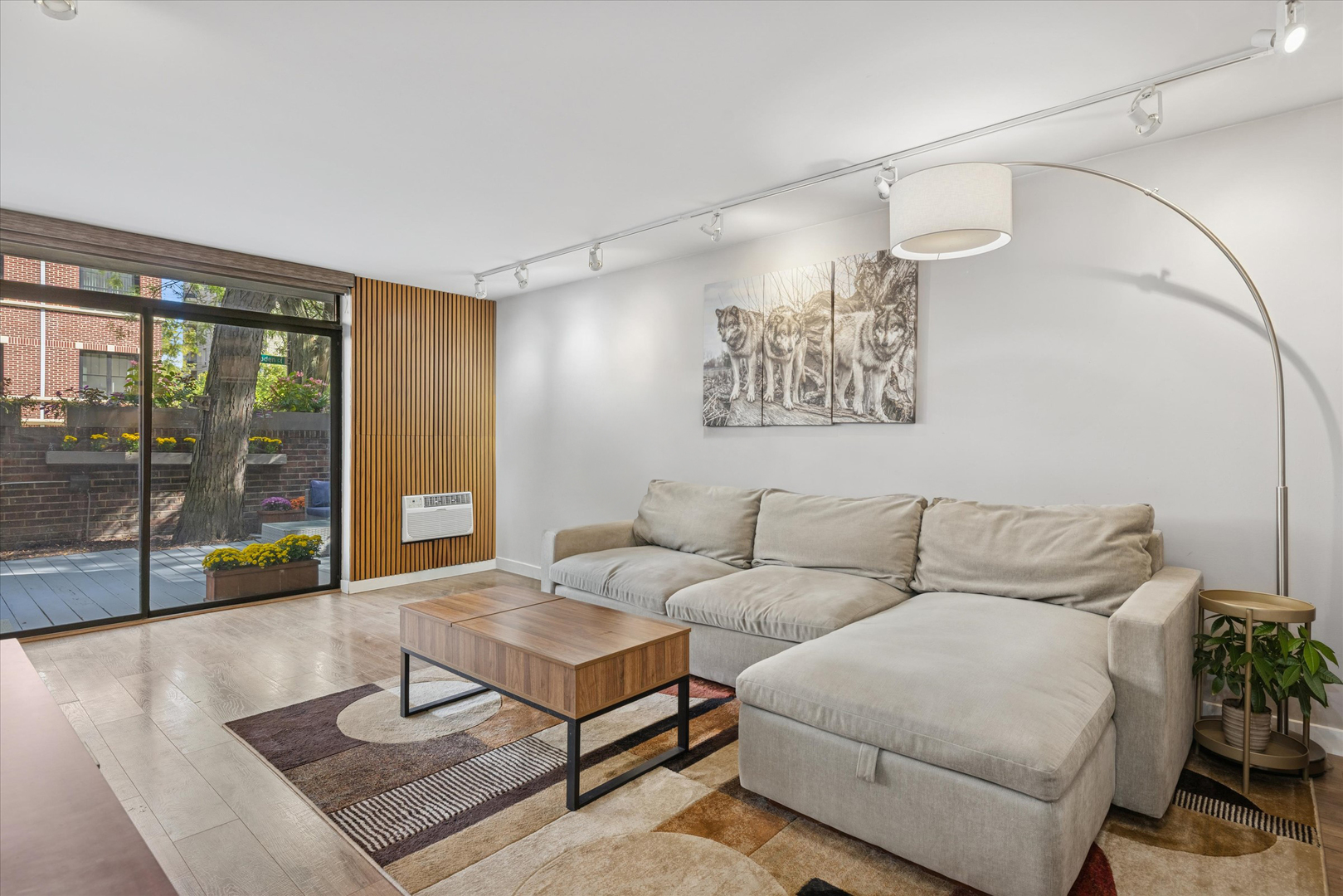 2600 North Hampden Court, Unit J1 Chicago, IL 60614 - Photo 2 of 16 a living room with furniture and a floor to ceiling window