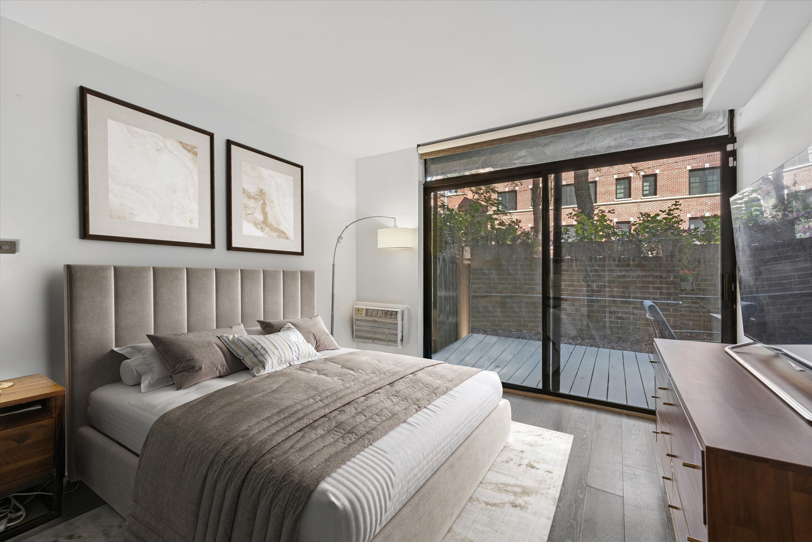 2600 North Hampden Court, Unit J1 Chicago, IL 60614 - Photo 9 of 16 a bedroom with a balcony a bed and a large window