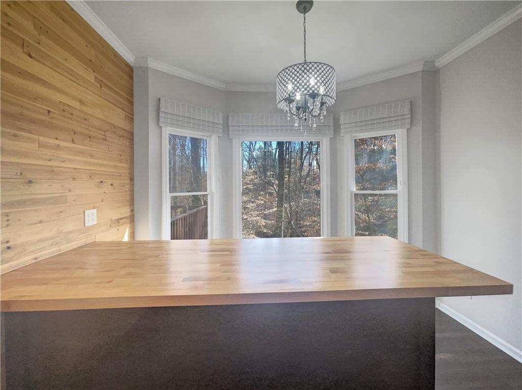 3950 Bear Ridge Place Northwest Kennesaw, GA 30144 - Photo 12 of 41 a view of an empty room with wooden floor and a window