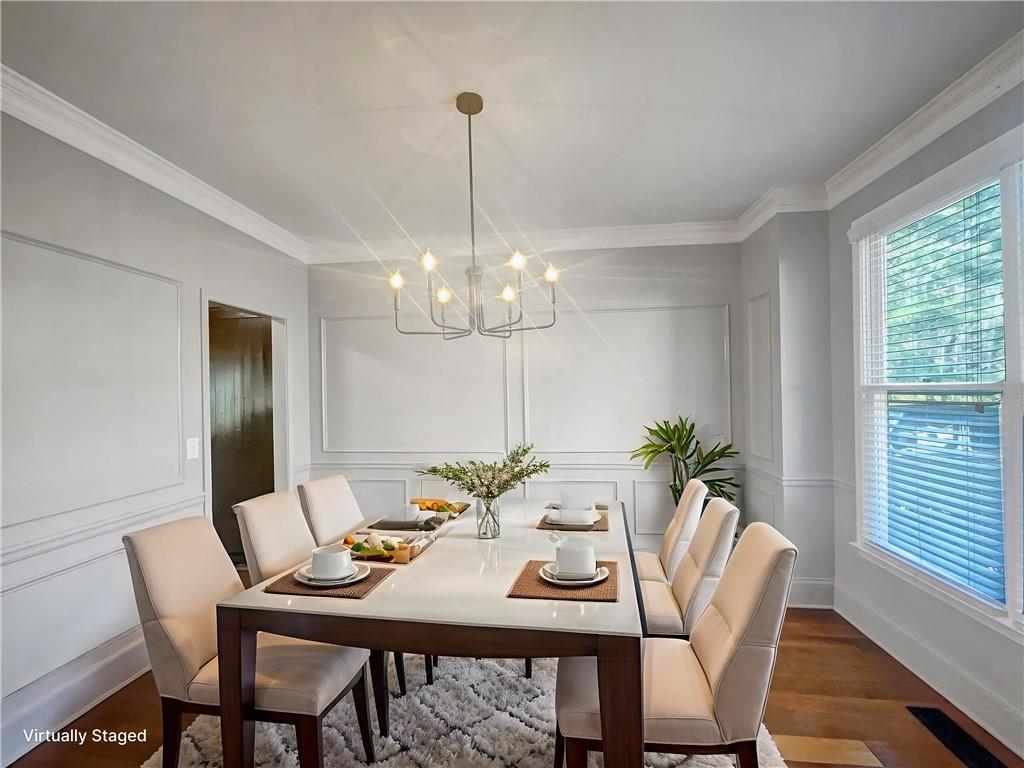 3950 Bear Ridge Place Northwest Kennesaw, GA 30144 - Photo 15 of 41 a view of a dining room with furniture window and wooden floor