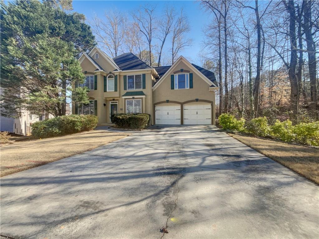 3950 Bear Ridge Place Northwest Kennesaw, GA 30144 - Photo 2 of 41 a front view of a house with a yard