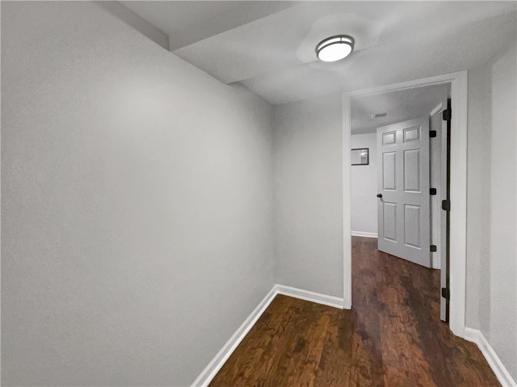 3950 Bear Ridge Place Northwest Kennesaw, GA 30144 - Photo 23 of 41 a view of an empty room and wooden floor