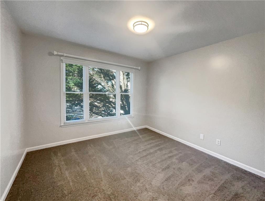 3950 Bear Ridge Place Northwest Kennesaw, GA 30144 - Photo 26 of 41 an empty room with windows