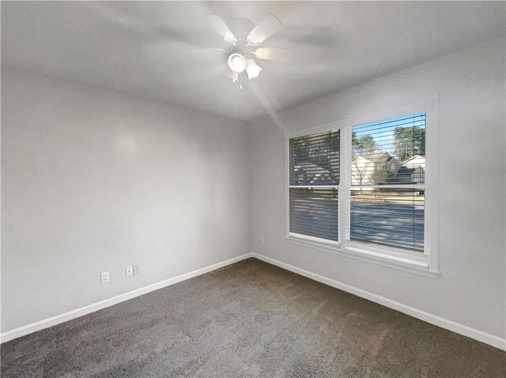 3950 Bear Ridge Place Northwest Kennesaw, GA 30144 - Photo 27 of 41 a view of an empty room with a window