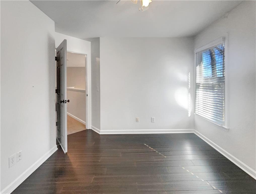 3950 Bear Ridge Place Northwest Kennesaw, GA 30144 - Photo 29 of 41 an empty room with wooden floor and windows