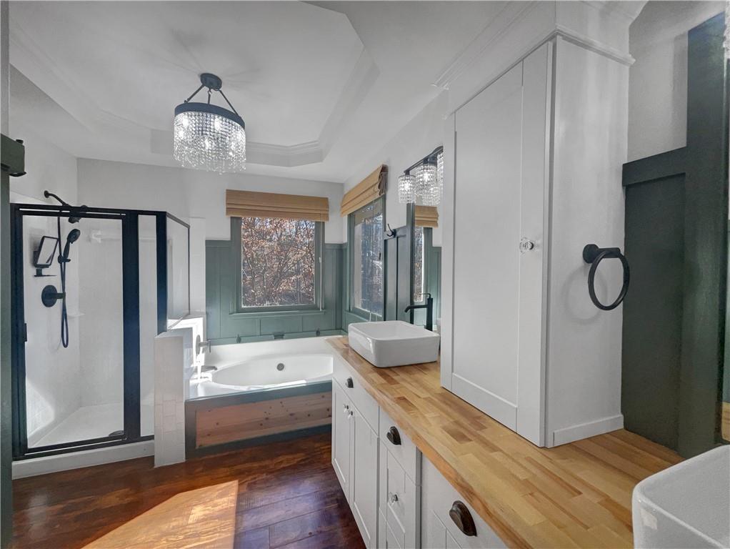3950 Bear Ridge Place Northwest Kennesaw, GA 30144 - Photo 33 of 41 a large bathroom with a tub shower and sink