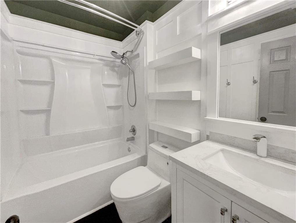 3950 Bear Ridge Place Northwest Kennesaw, GA 30144 - Photo 35 of 41 a bathroom with a sink toilet and shower