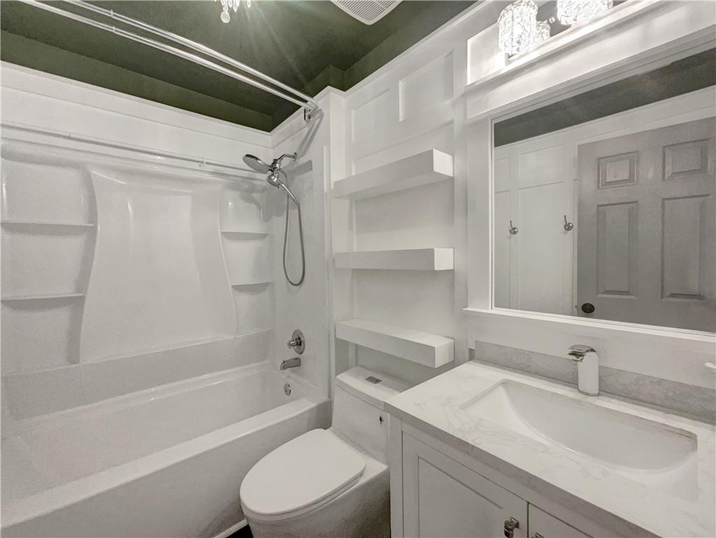 3950 Bear Ridge Place Northwest Kennesaw, GA 30144 - Photo 36 of 41 a bathroom with a sink toilet vanity and shower