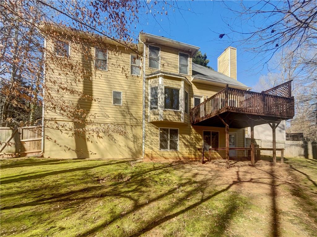 3950 Bear Ridge Place Northwest Kennesaw, GA 30144 - Photo 39 of 41 a front view of a building with a garden