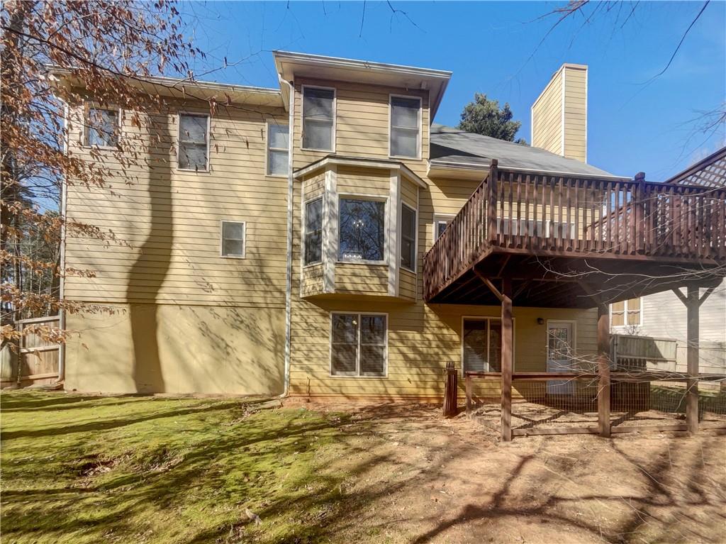 3950 Bear Ridge Place Northwest Kennesaw, GA 30144 - Photo 40 of 41 a view of a house with a wooden fence