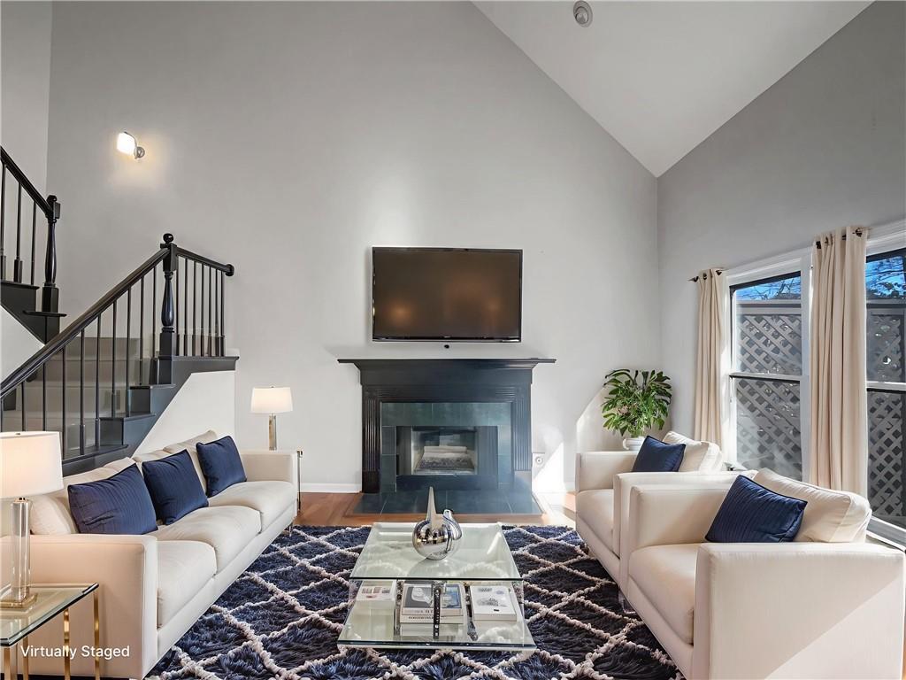 3950 Bear Ridge Place Northwest Kennesaw, GA 30144 - Photo 5 of 41 a living room with furniture and a fireplace