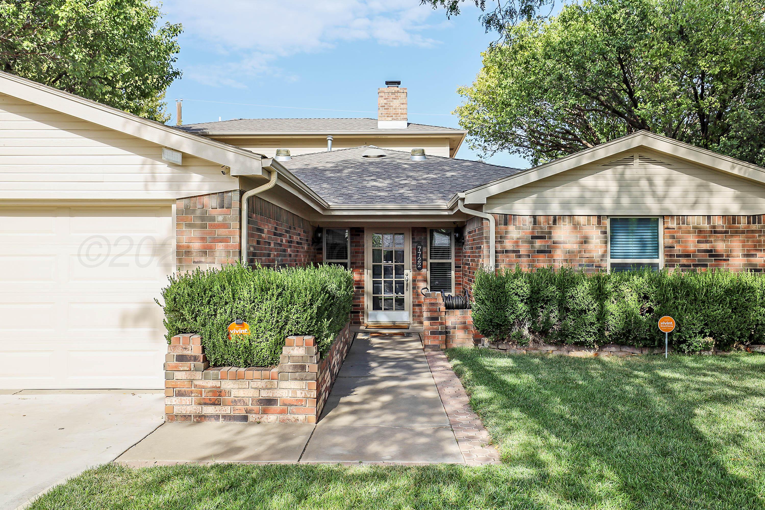 7722 Canode Drive Amarillo, TX 79121 - Photo 2 of 40 a front view of a house with a yard