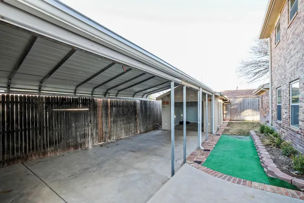 a view of backyard with seating space and stairs