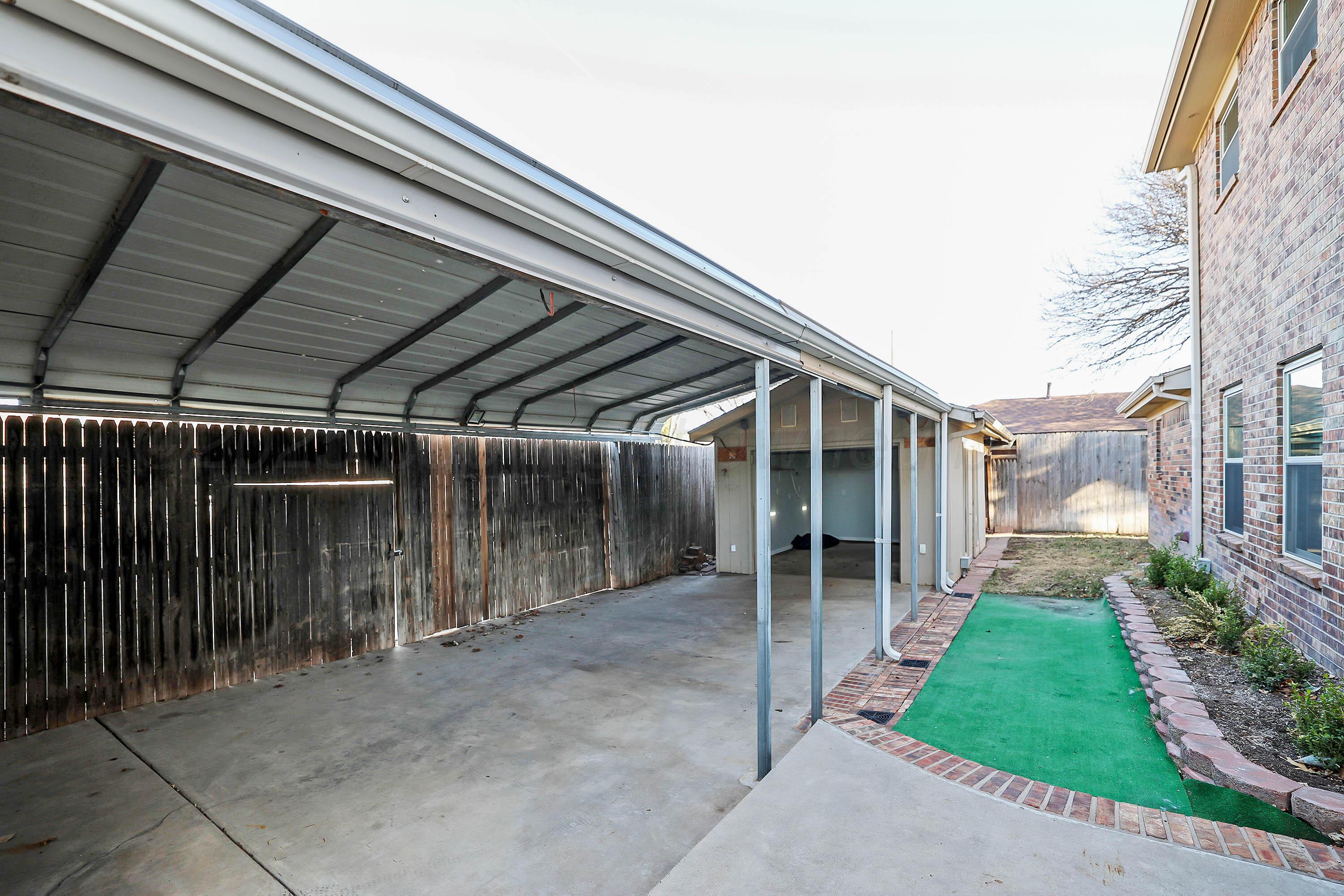 7722 Canode Drive Amarillo, TX 79121 - Photo 3 of 40 a view of backyard with seating space and stairs