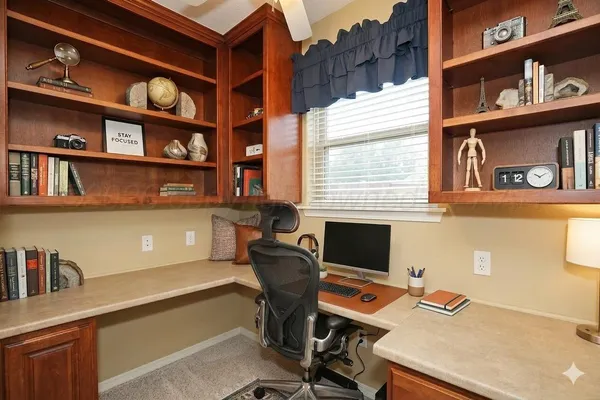a kitchen with stainless steel appliances granite countertop a sink refrigerator and cabinets