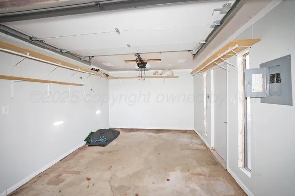 a view of an empty room with wooden walls