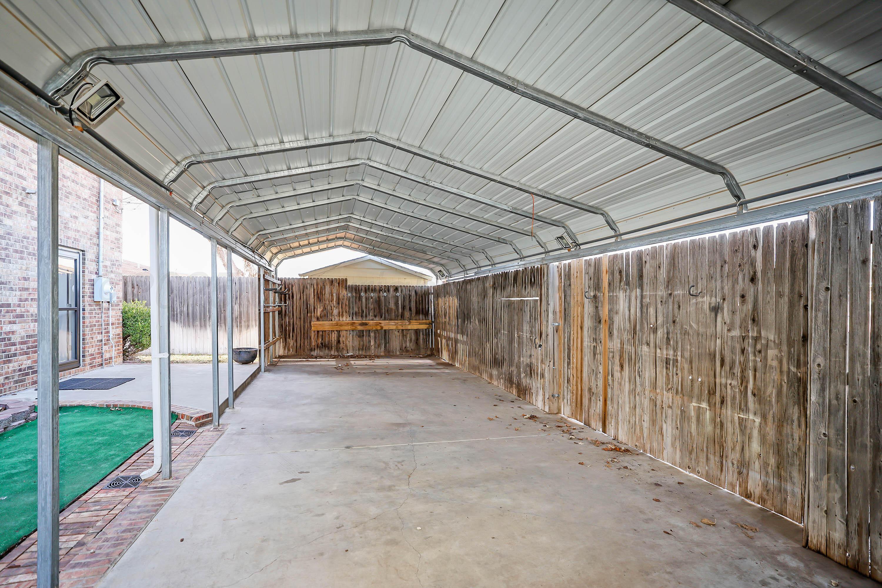 7722 Canode Drive Amarillo, TX 79121 - Photo 35 of 40 a view of an empty room with wooden walls