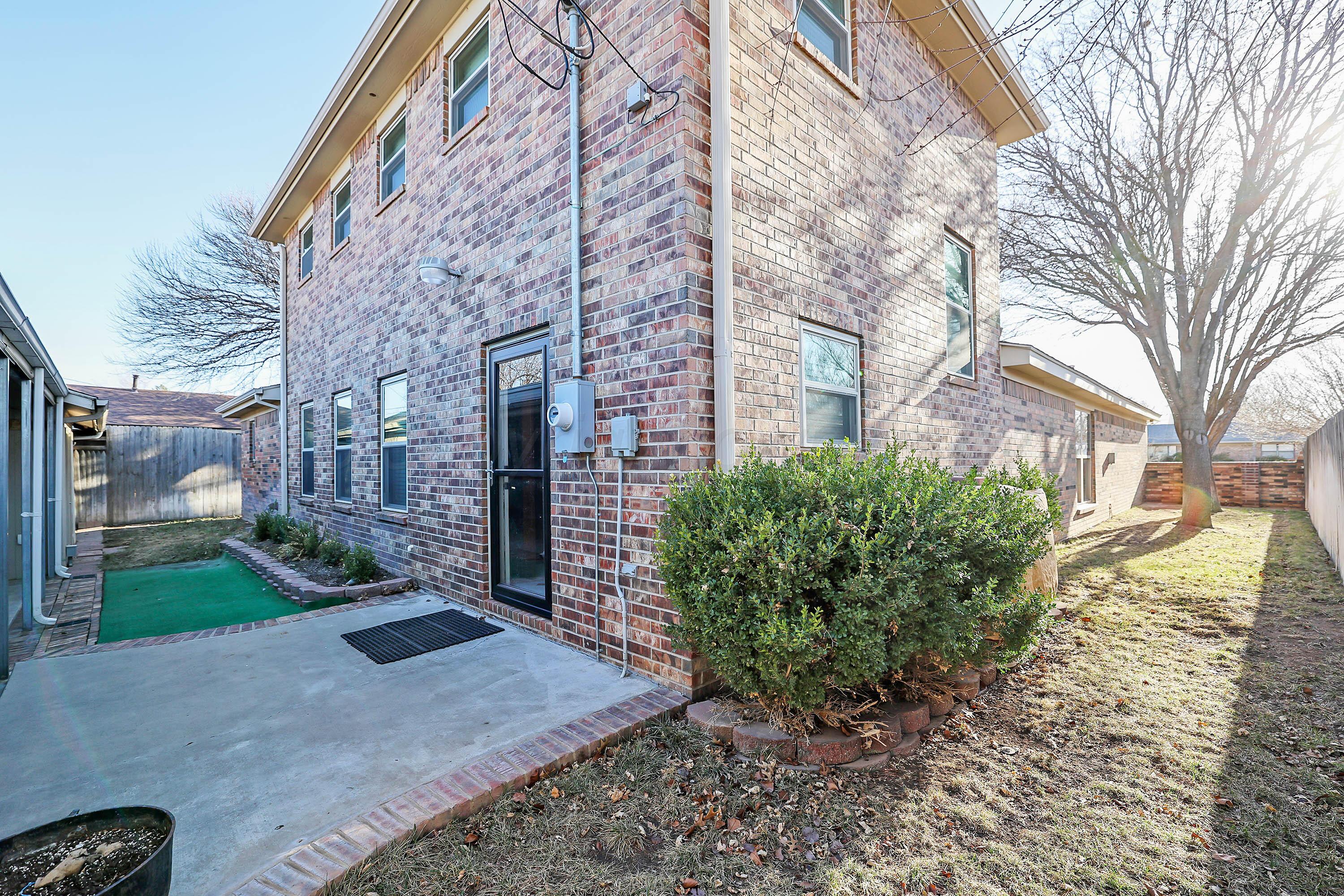 7722 Canode Drive Amarillo, TX 79121 - Photo 36 of 40 a view of a building with a yard