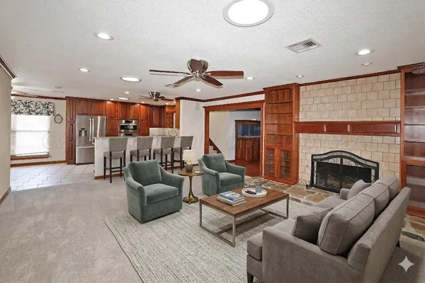 a living room with furniture and a fireplace