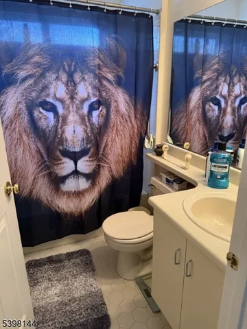 a bathroom with a toilet and a sink