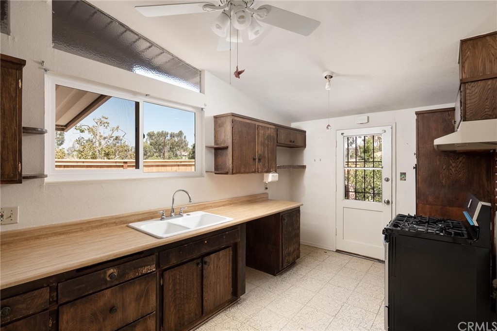 12540 Taunt Place Poway, CA 92064 - Photo 15 of 36 a kitchen with a sink appliances and a window