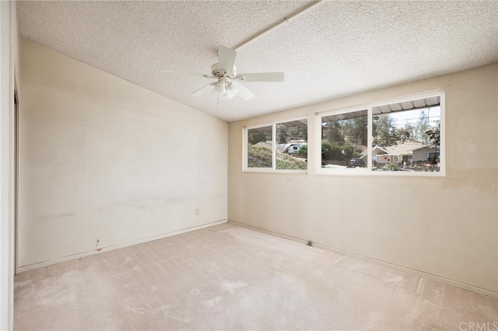 12540 Taunt Place Poway, CA 92064 - Photo 18 of 36 an empty room with windows