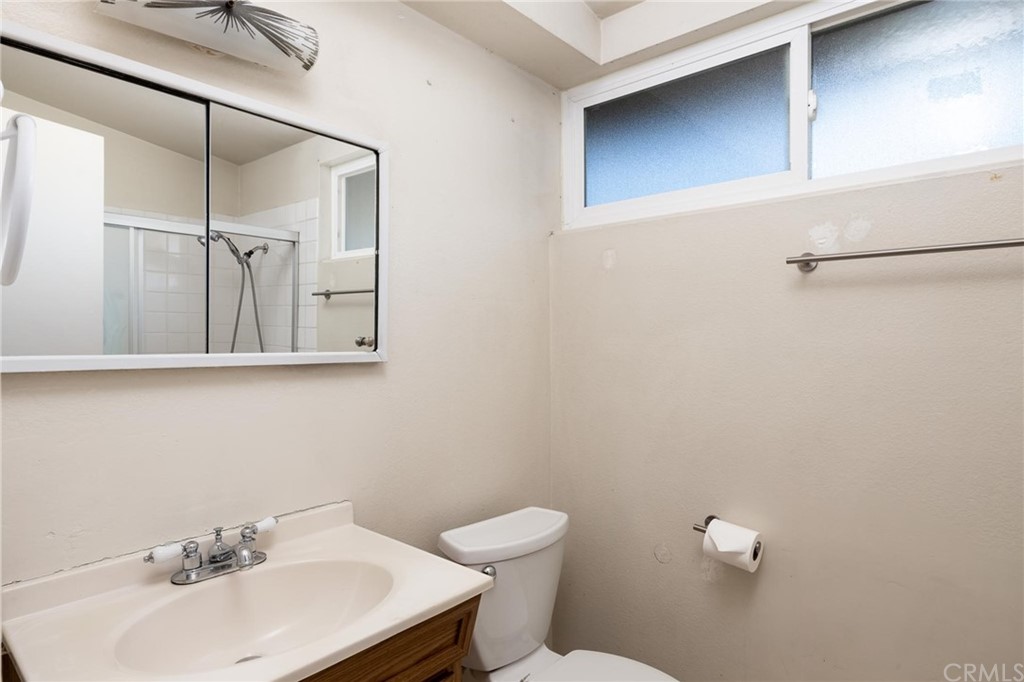 12540 Taunt Place Poway, CA 92064 - Photo 21 of 36 a bathroom with a sink a toilet and mirror