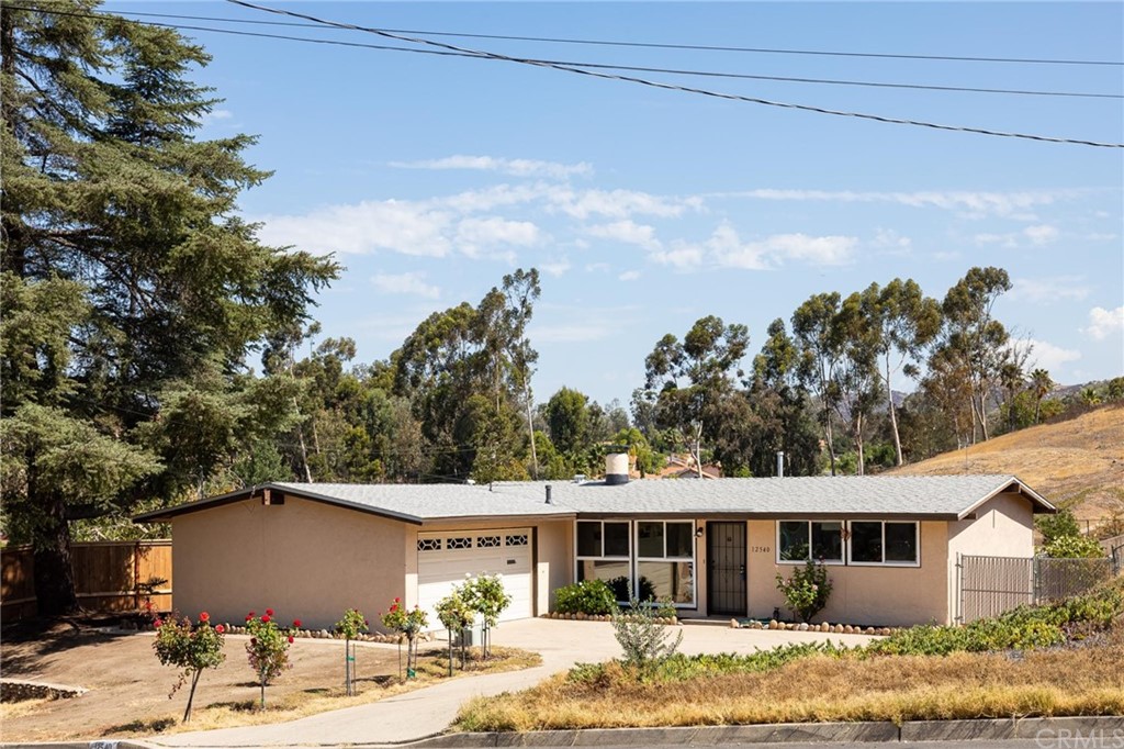 12540 Taunt Place Poway, CA 92064 - Photo 3 of 36 a view of a yard in front of house