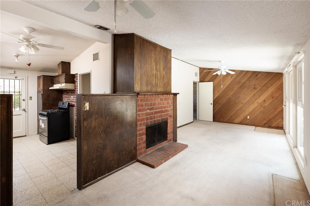 12540 Taunt Place Poway, CA 92064 - Photo 10 of 36 a kitchen with refrigerator and window