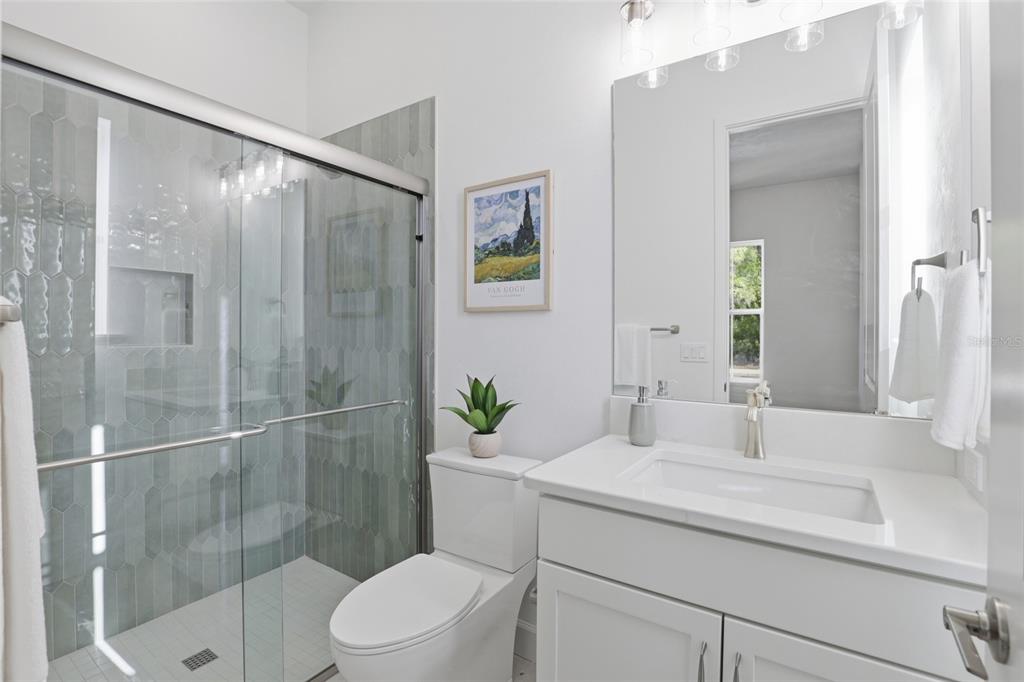13425 Southwest 9th Road Newberry, FL 32669 - Photo 25 of 46 a bathroom with a sink toilet and shower