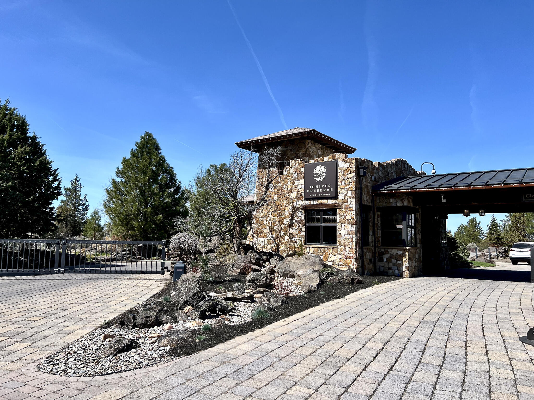22887 Ghost Tree Lane Bend, OR 97701 - Photo 86 of 97 The entry gatehouse not only enhances security but also adds a distinguished sense of exclusivity, setting the tone for the elegance within.