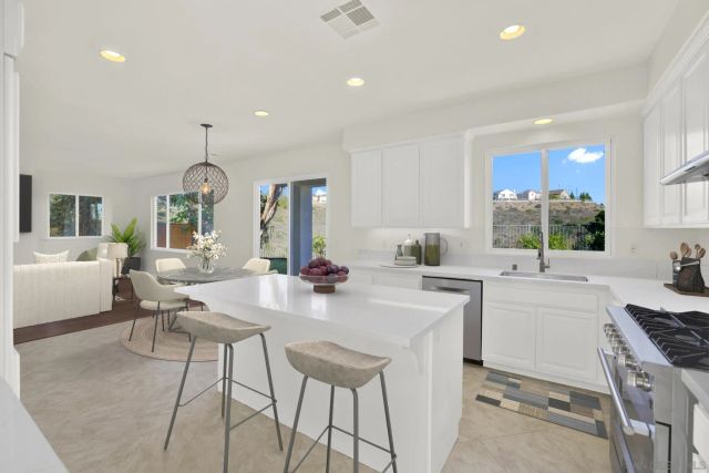 a living room with fireplace furniture and a flat screen tv