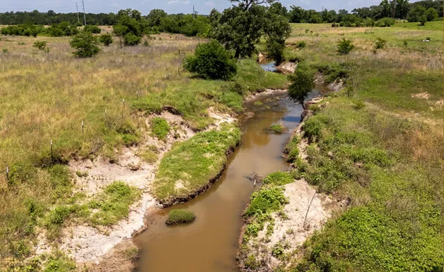 a view of a lake in middle of the town