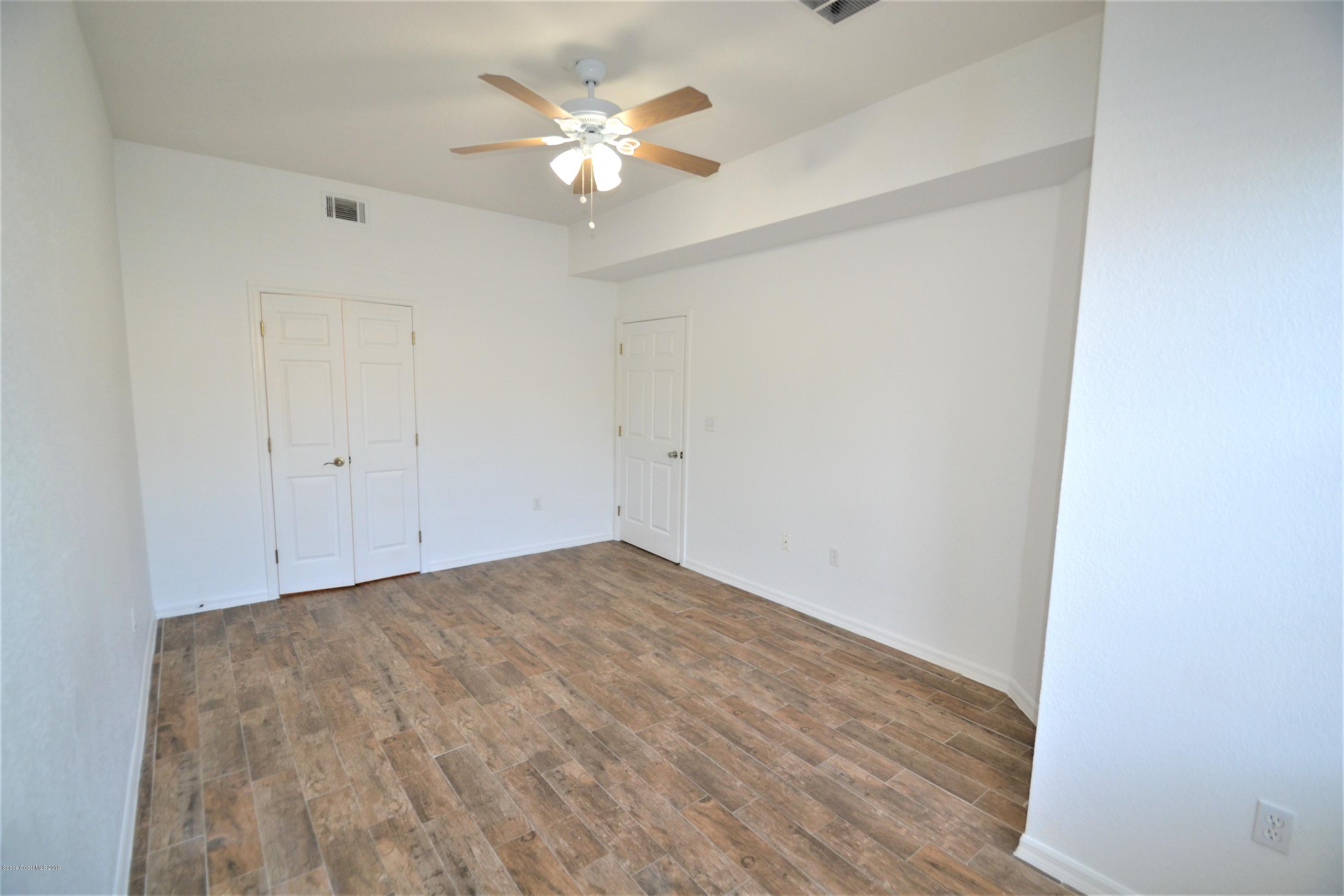 115 Turpial Way, Unit 103 Melbourne, FL 32901 - Photo 14 of 38 115 Turpial #103 Master Suite (8)