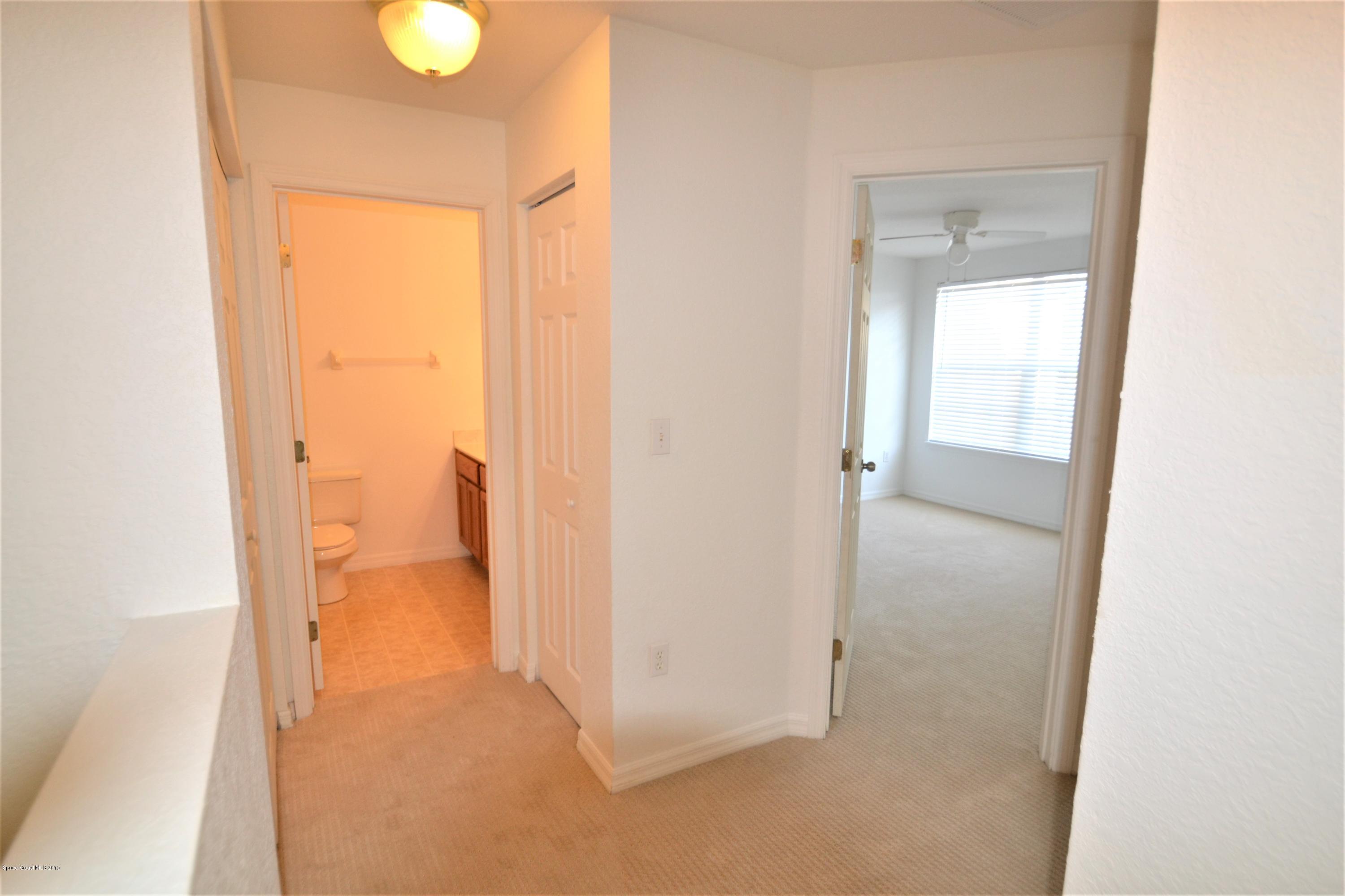 115 Turpial Way, Unit 103 Melbourne, FL 32901 - Photo 17 of 38 115 Turpial #103 Upstairs Hall (1)