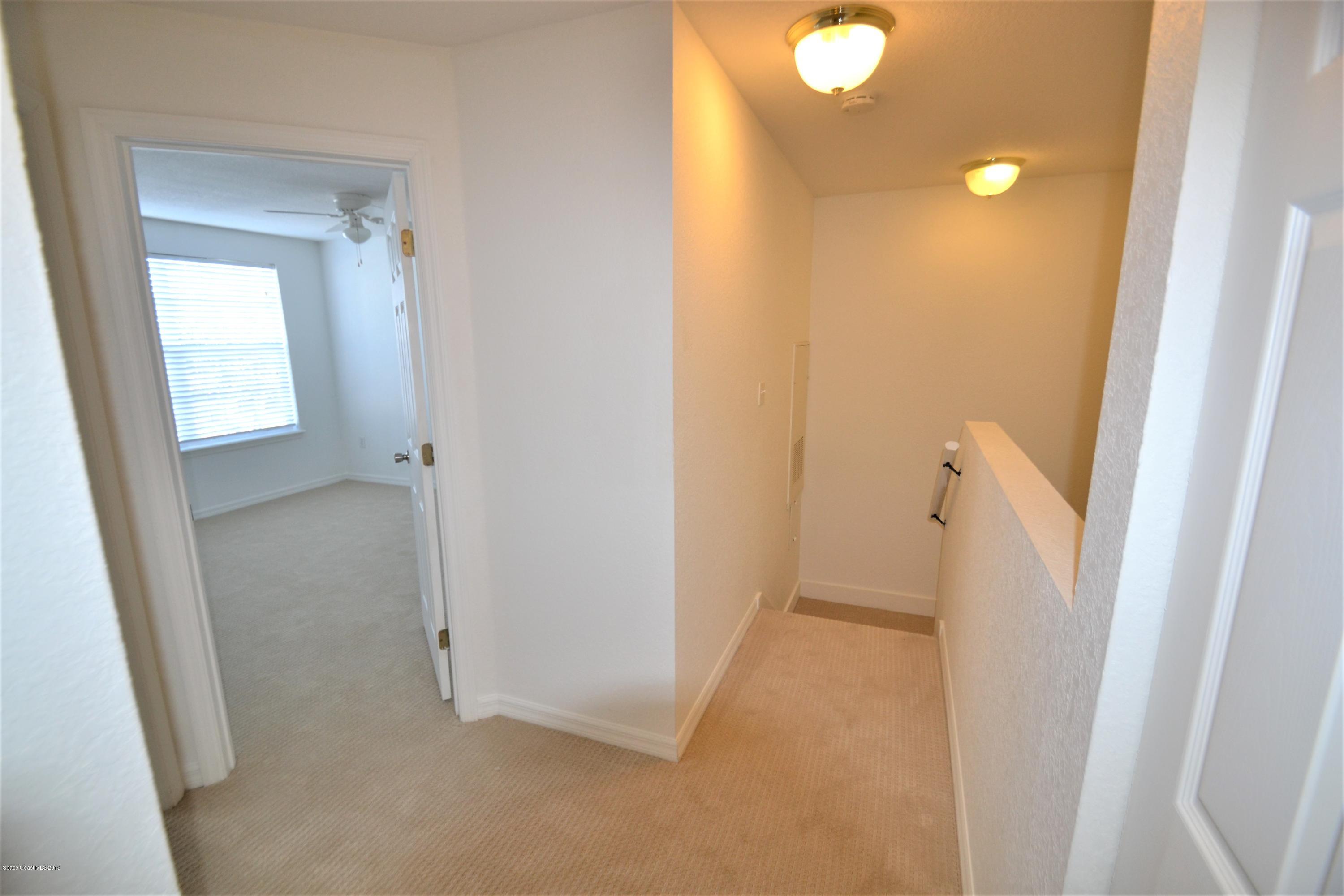 115 Turpial Way, Unit 103 Melbourne, FL 32901 - Photo 20 of 38 115 Turpial #103 Upstairs Hall (4)
