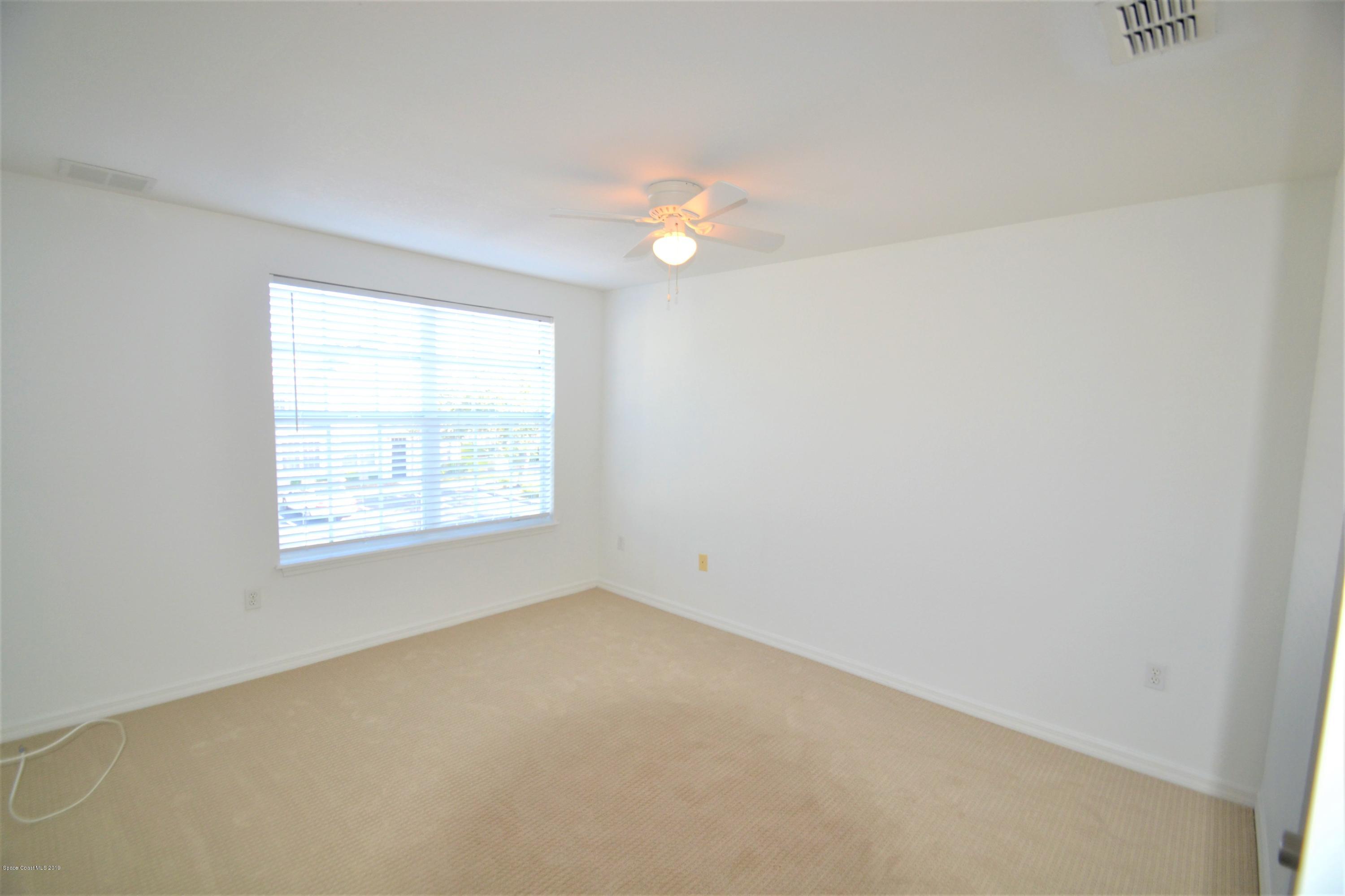 115 Turpial Way, Unit 103 Melbourne, FL 32901 - Photo 22 of 38 115 Turpial #103 Second Bedroom (3)
