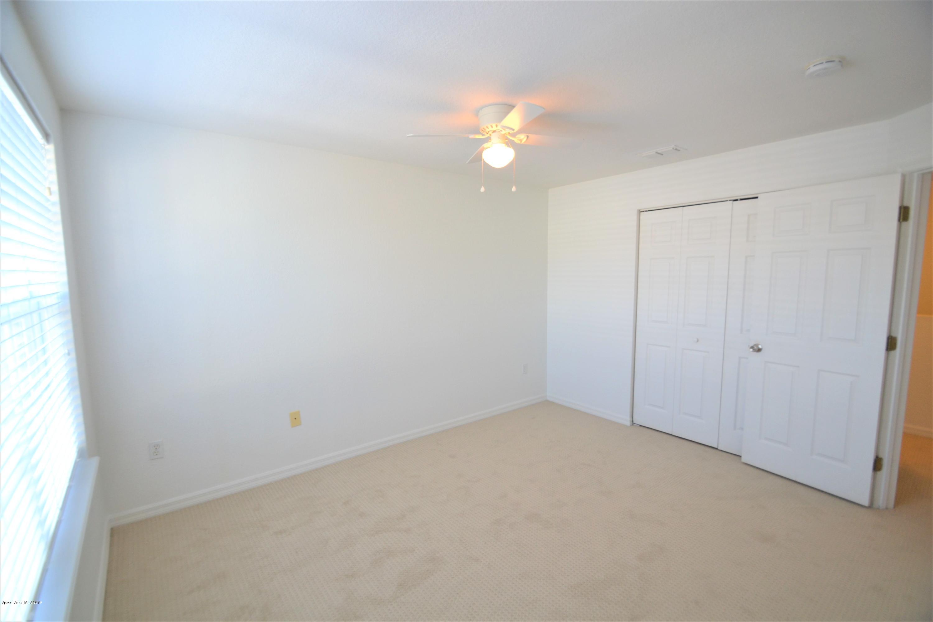 115 Turpial Way, Unit 103 Melbourne, FL 32901 - Photo 23 of 38 115 Turpial #103 Second Bedroom (6)