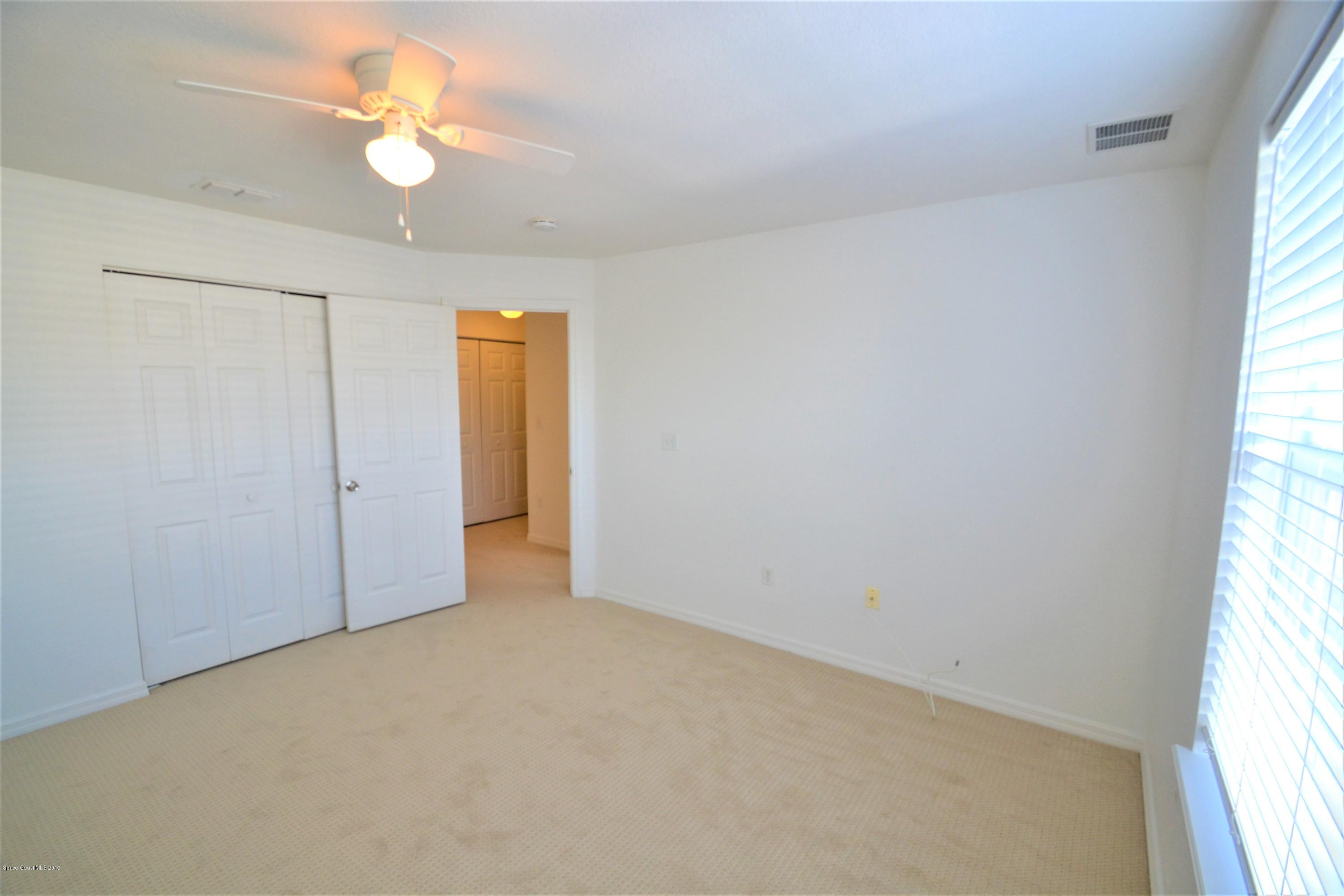 115 Turpial Way, Unit 103 Melbourne, FL 32901 - Photo 24 of 38 115 Turpial #103 Second Bedroom (1)