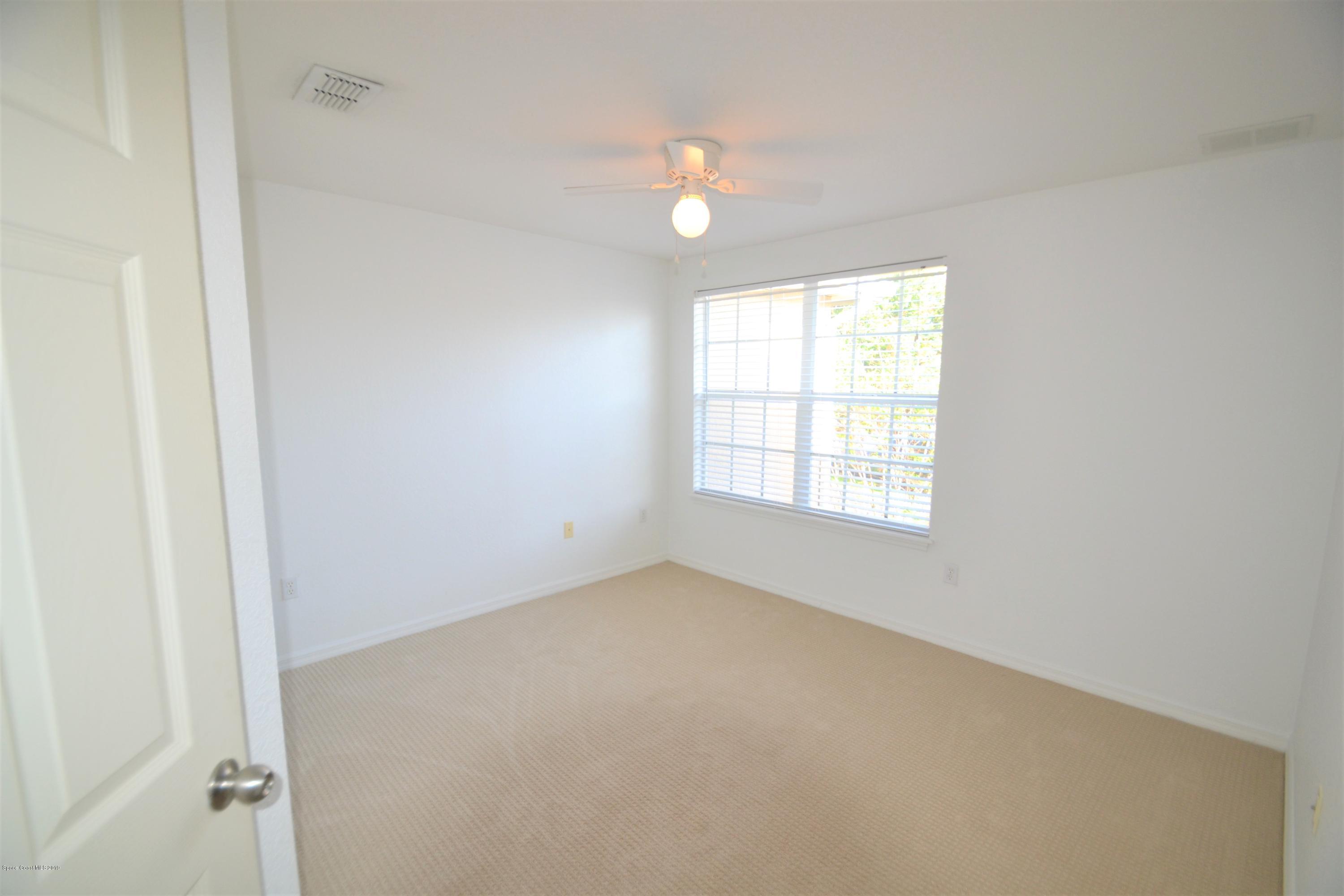 115 Turpial Way, Unit 103 Melbourne, FL 32901 - Photo 27 of 38 115 Turpial #103 Third Bedroom (12)