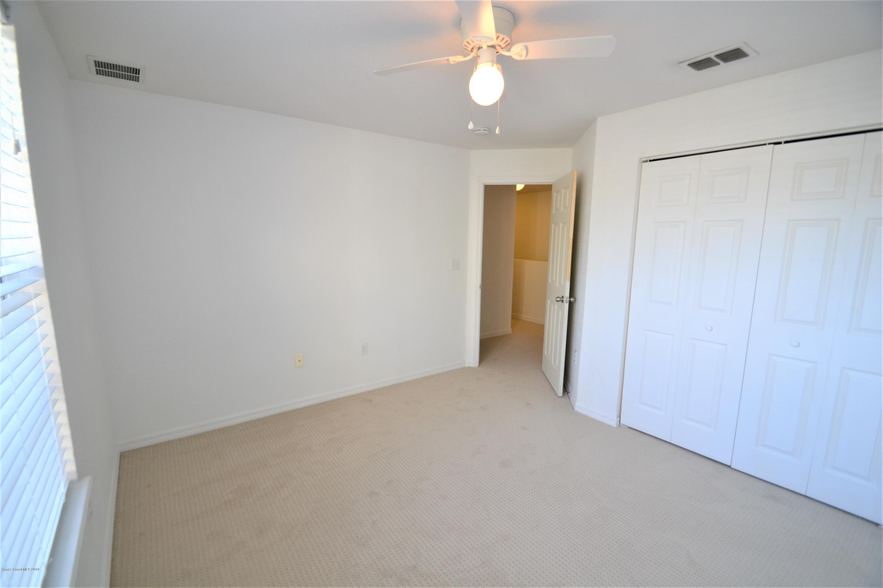 115 Turpial Way, Unit 103 Melbourne, FL 32901 - Photo 29 of 38 115 Turpial #103 Third Bedroom (8)