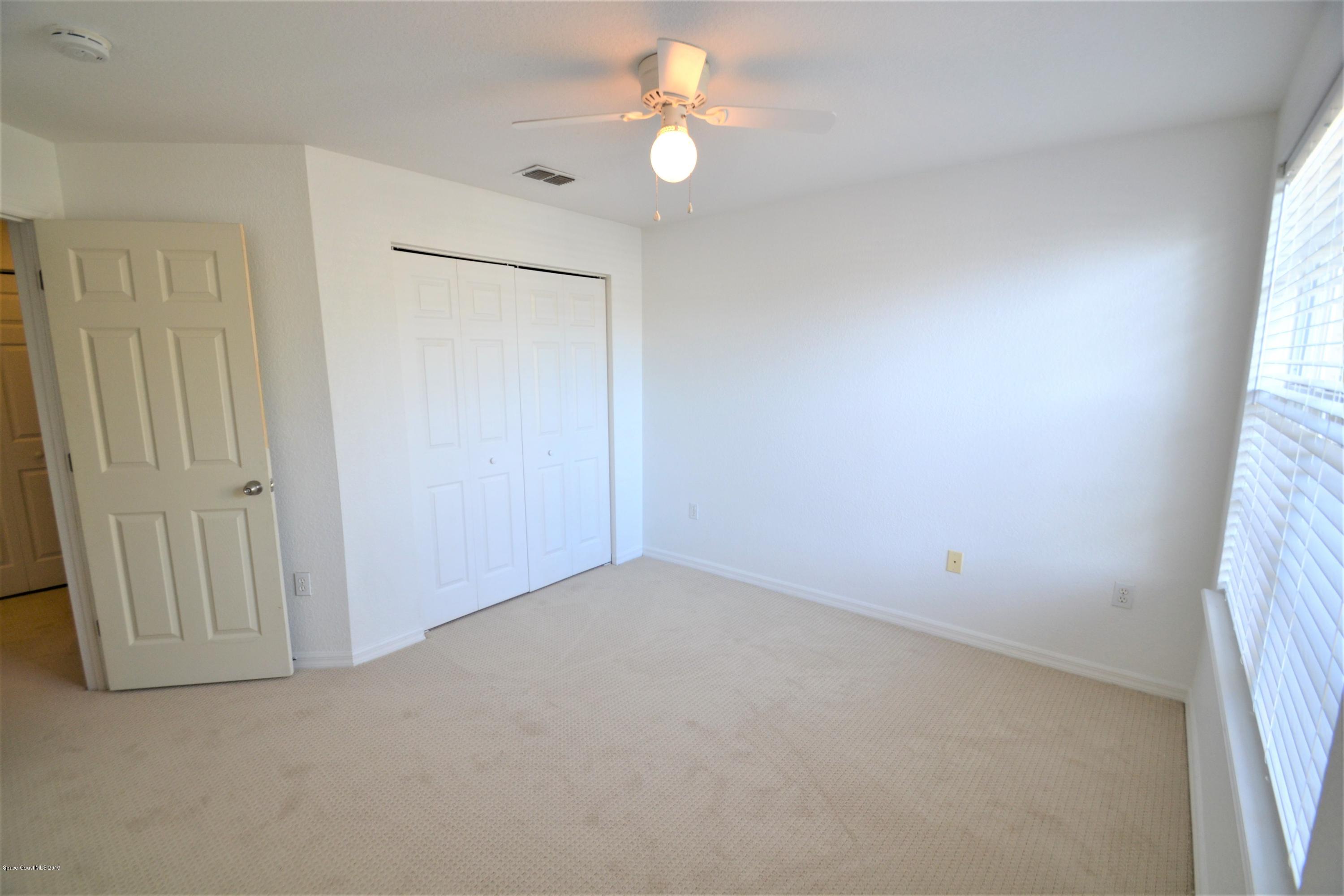 115 Turpial Way, Unit 103 Melbourne, FL 32901 - Photo 30 of 38 115 Turpial #103 Third Bedroom (14)