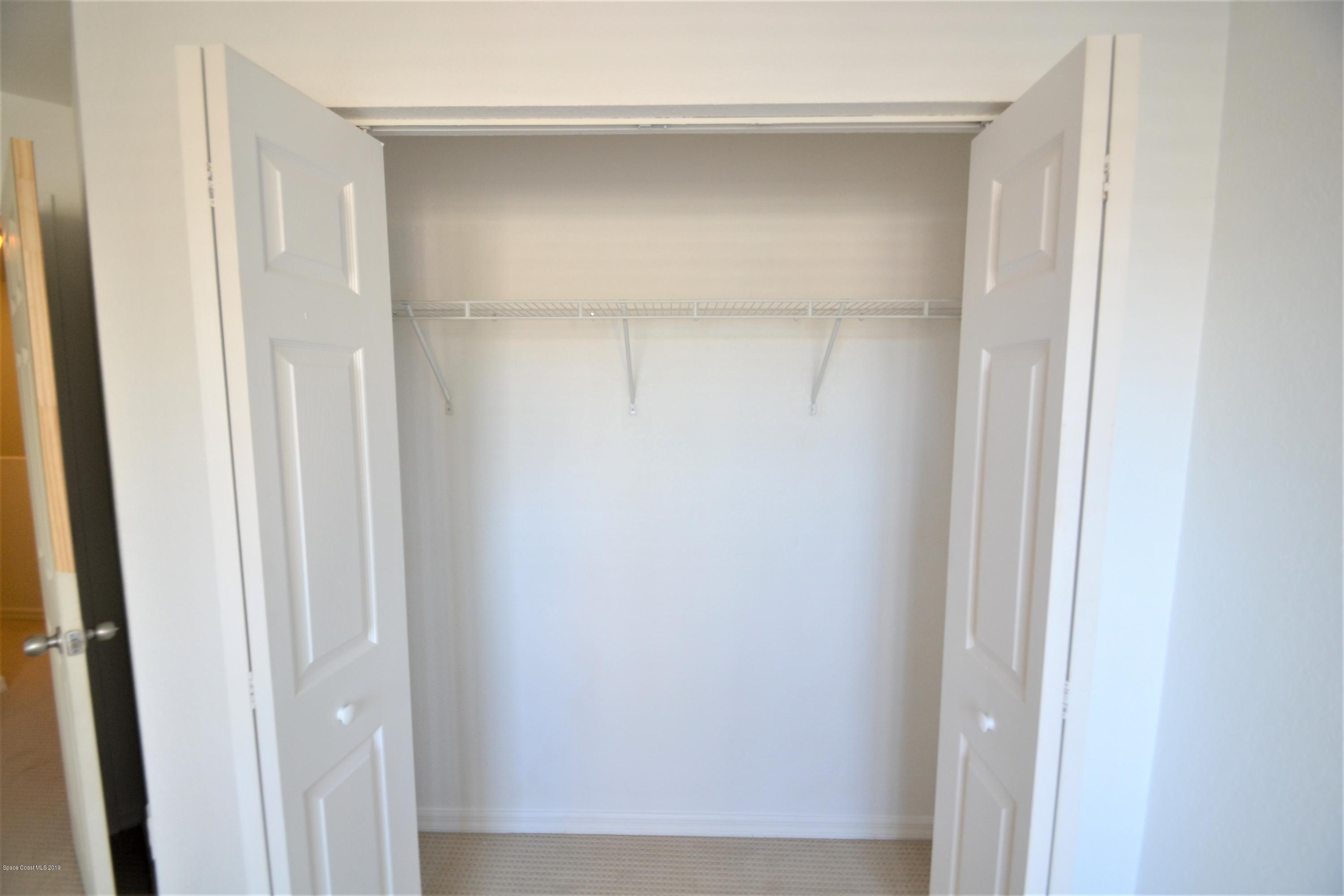115 Turpial Way, Unit 103 Melbourne, FL 32901 - Photo 31 of 38 115 Turpial #103 Third Bedroom (5)